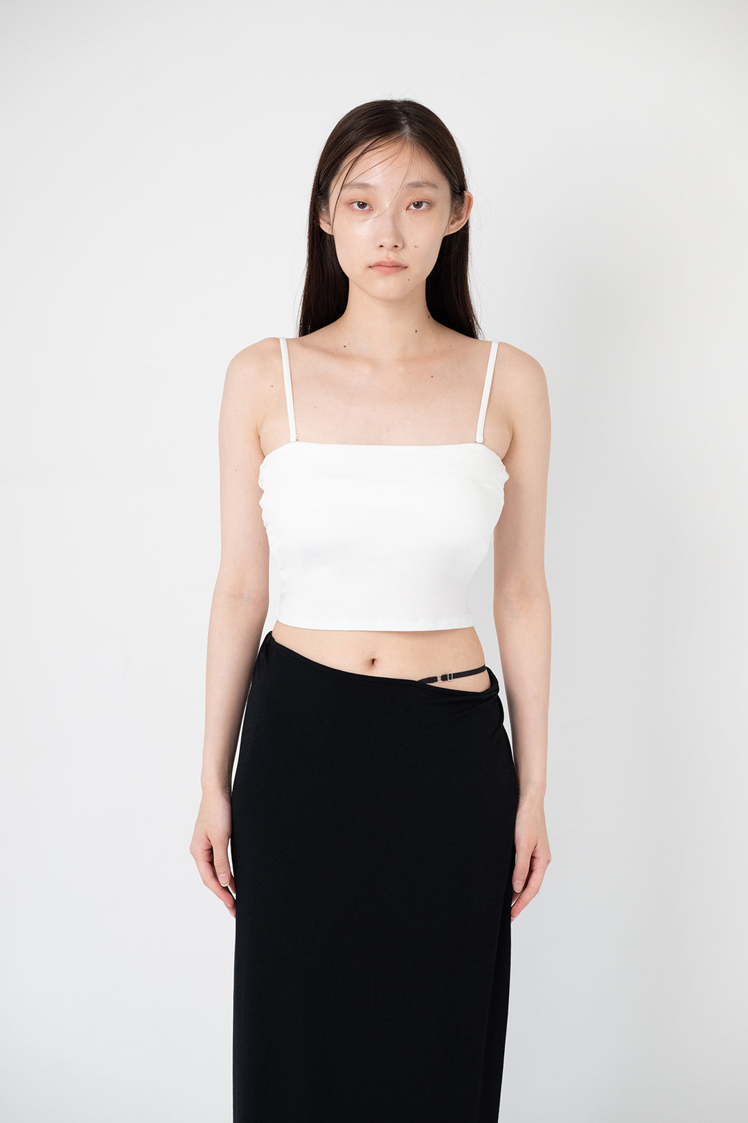 Woman modeling front of the white "Cami1"