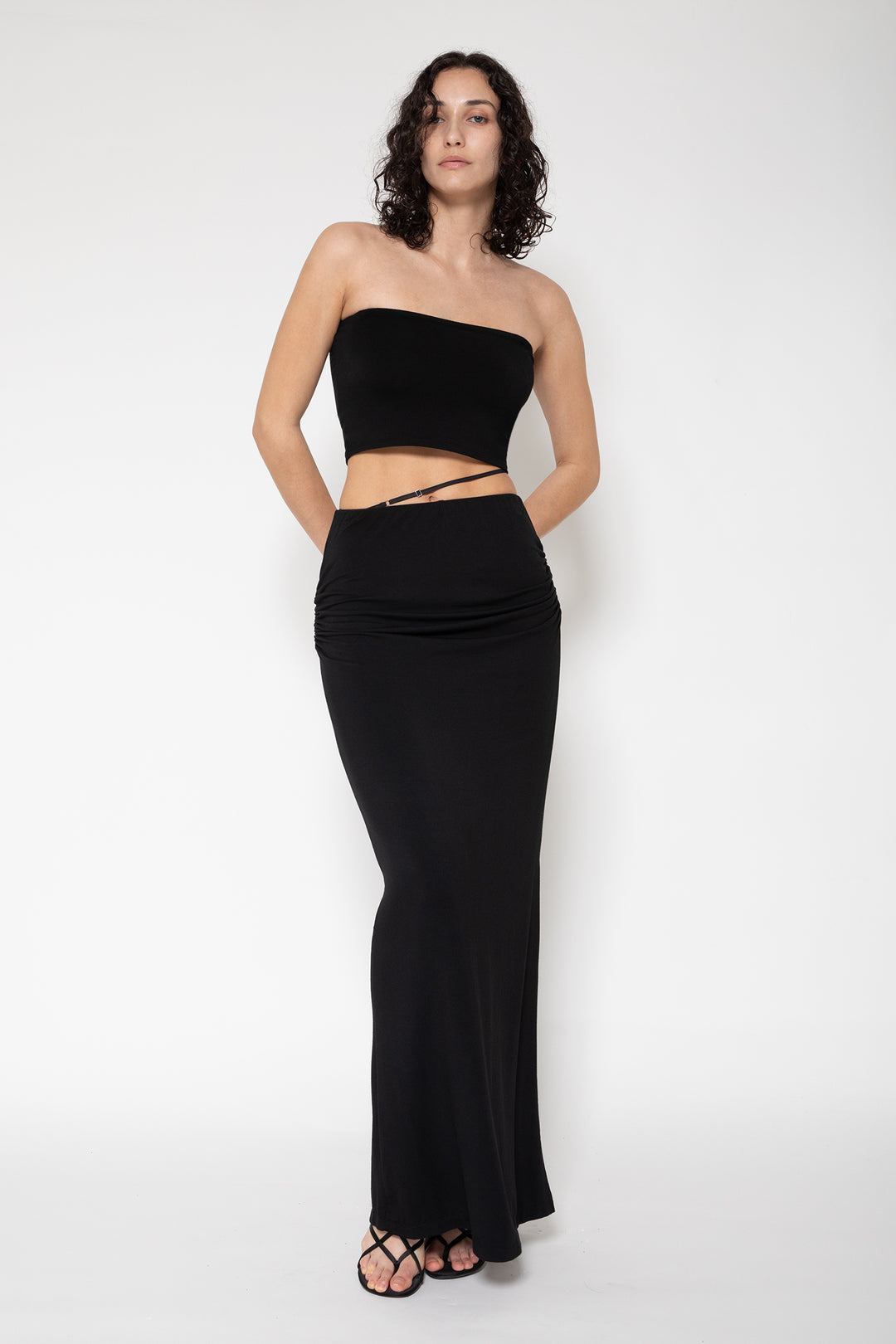 Woman modeling front of the black "Cami1"