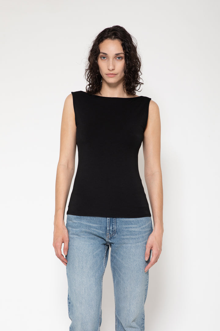 Woman modeling front of the black "Collagen Open Back Tank Top "