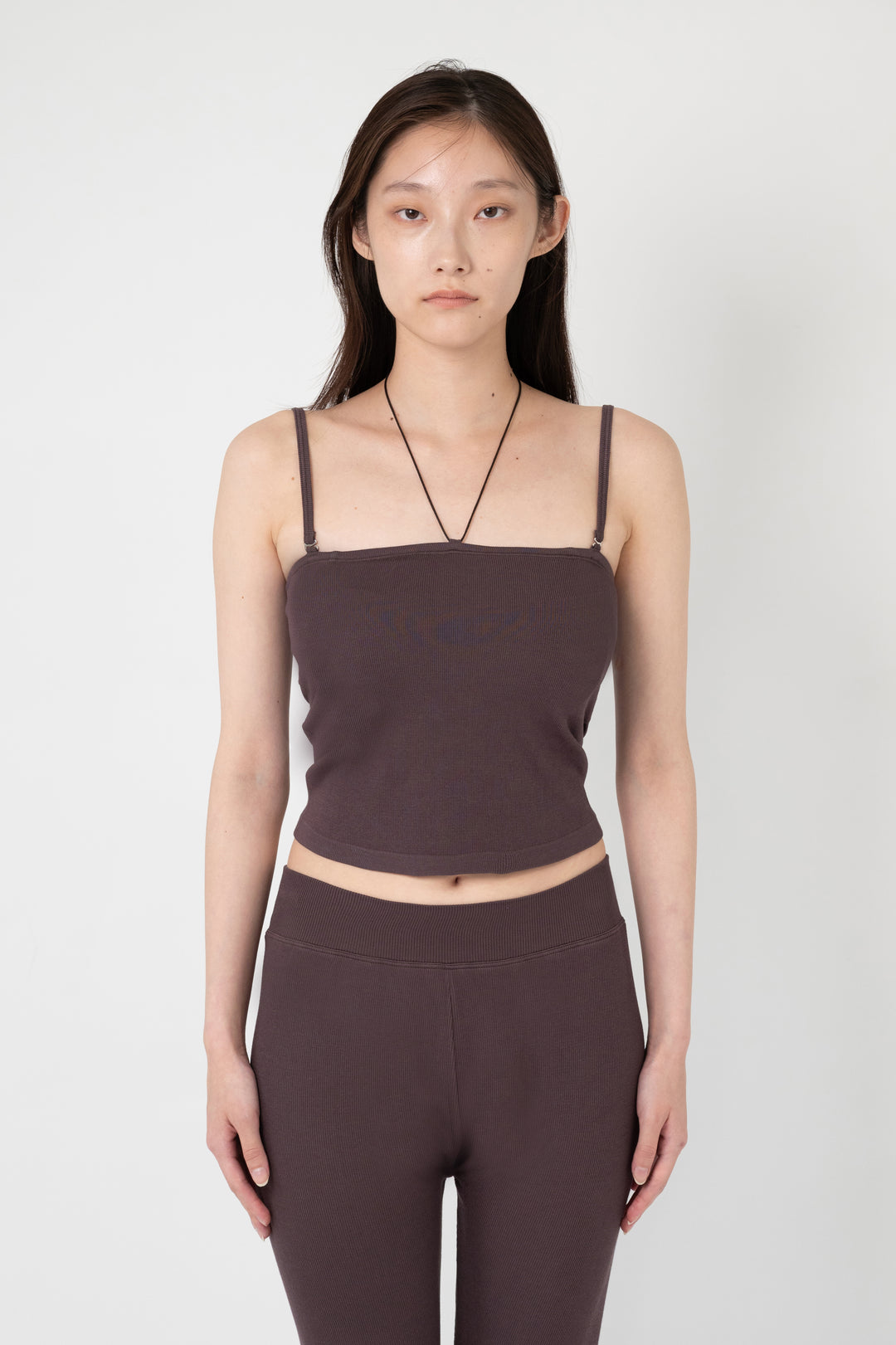 Woman modeling front of the dark brown”Collagen Ribbed Multiway Cami"