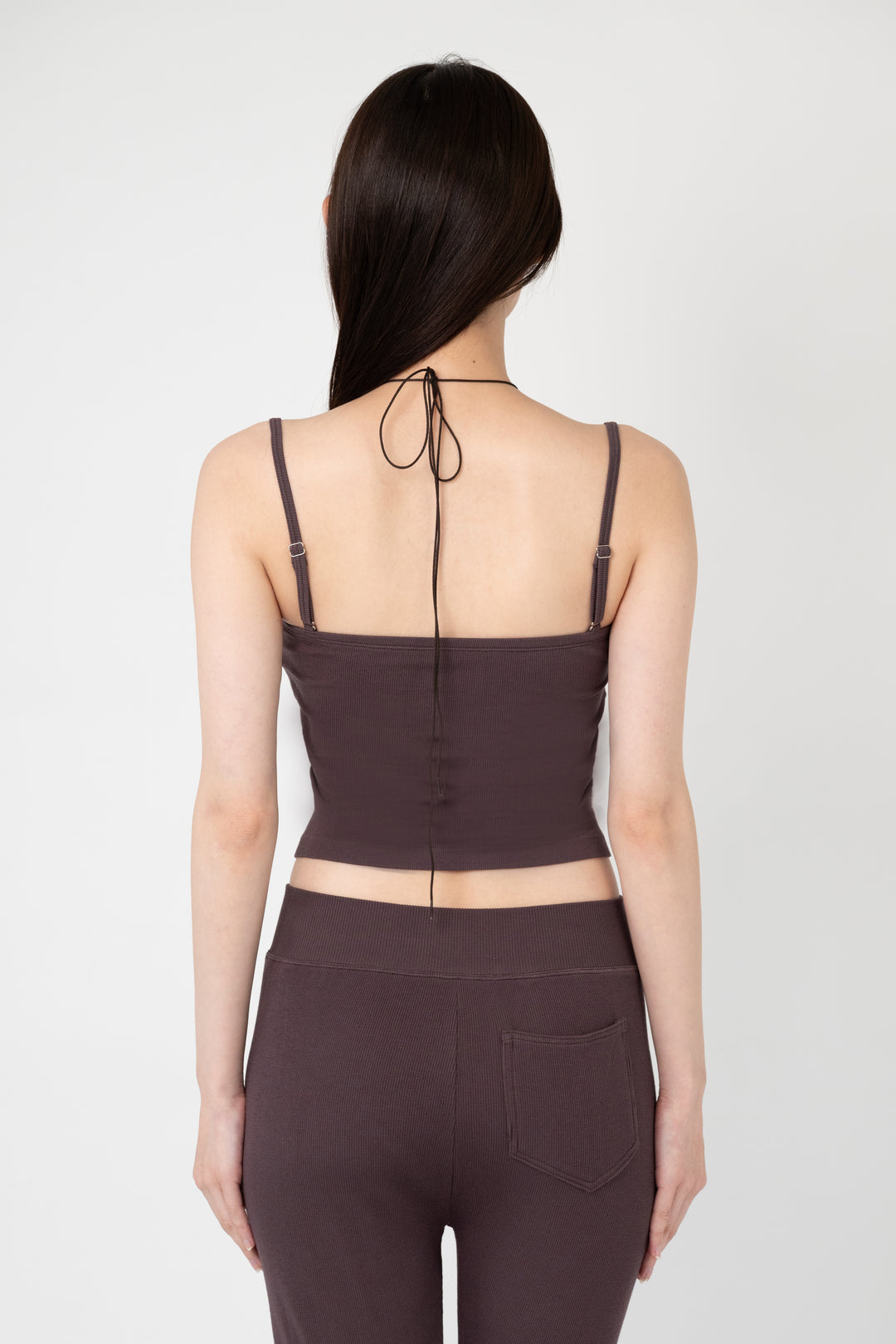 Woman modeling front of the dark brown”Collagen Ribbed Multiway Cami"