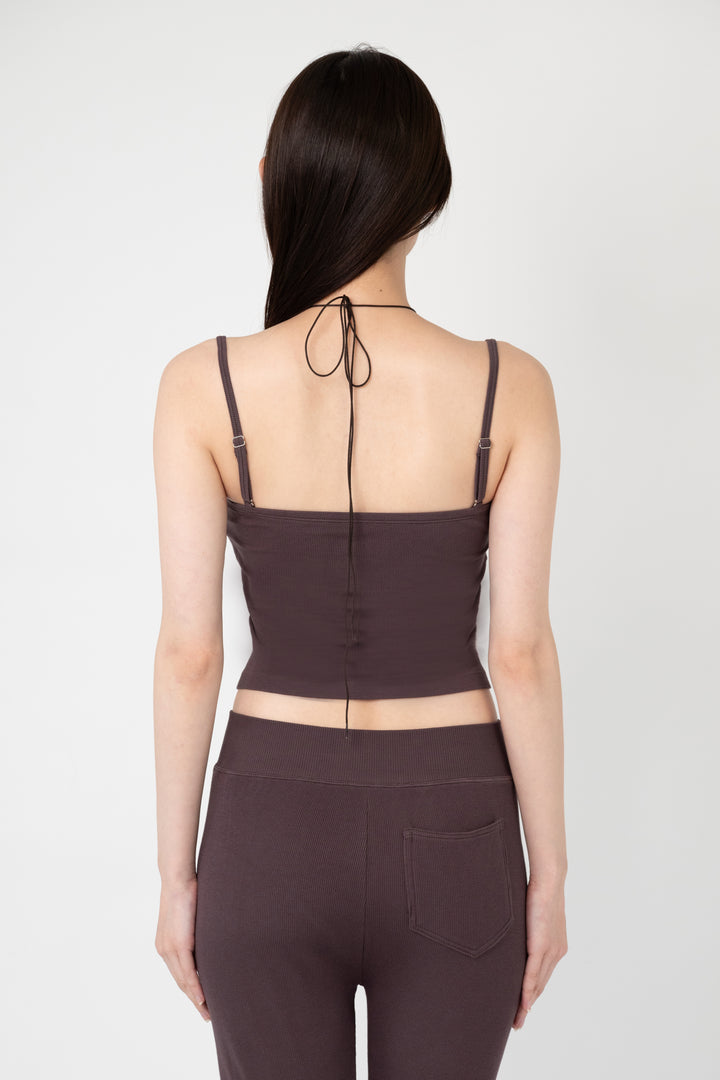 Woman modeling front of the dark brown”Collagen Ribbed Multiway Cami"