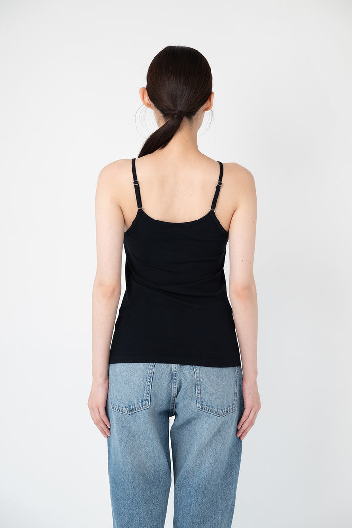 Woman modeling front of the black”Collagen Ribbed Tank Top"