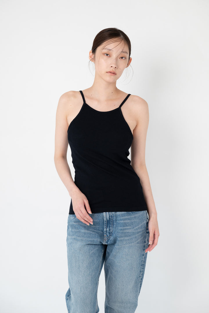 Woman modeling front of the black”Collagen Ribbed Tank Top"