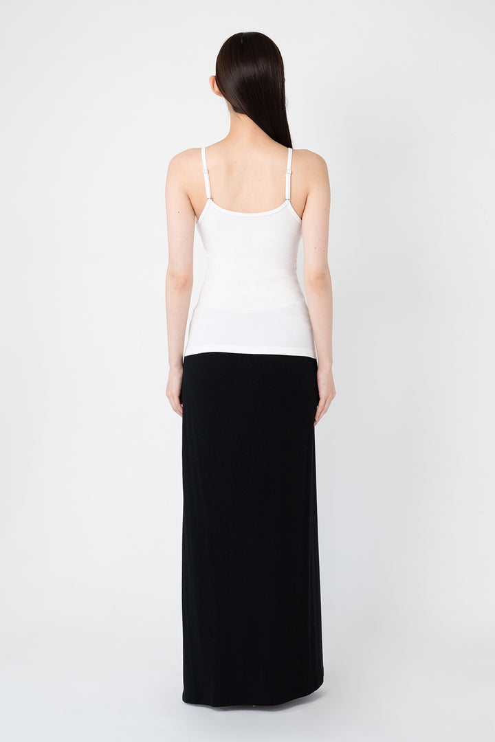 Woman modeling front of the white”Collagen Ribbed Tank Top"