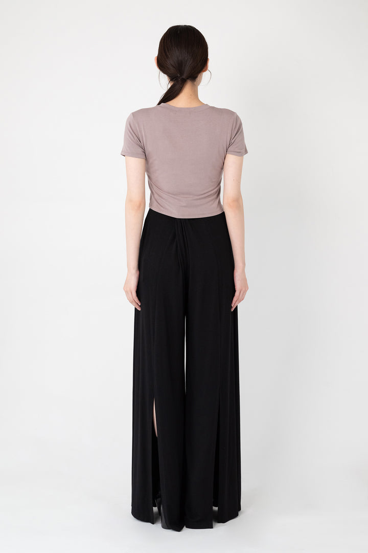 Woman modeling back of collagen fabric Back Slit Wide Pants