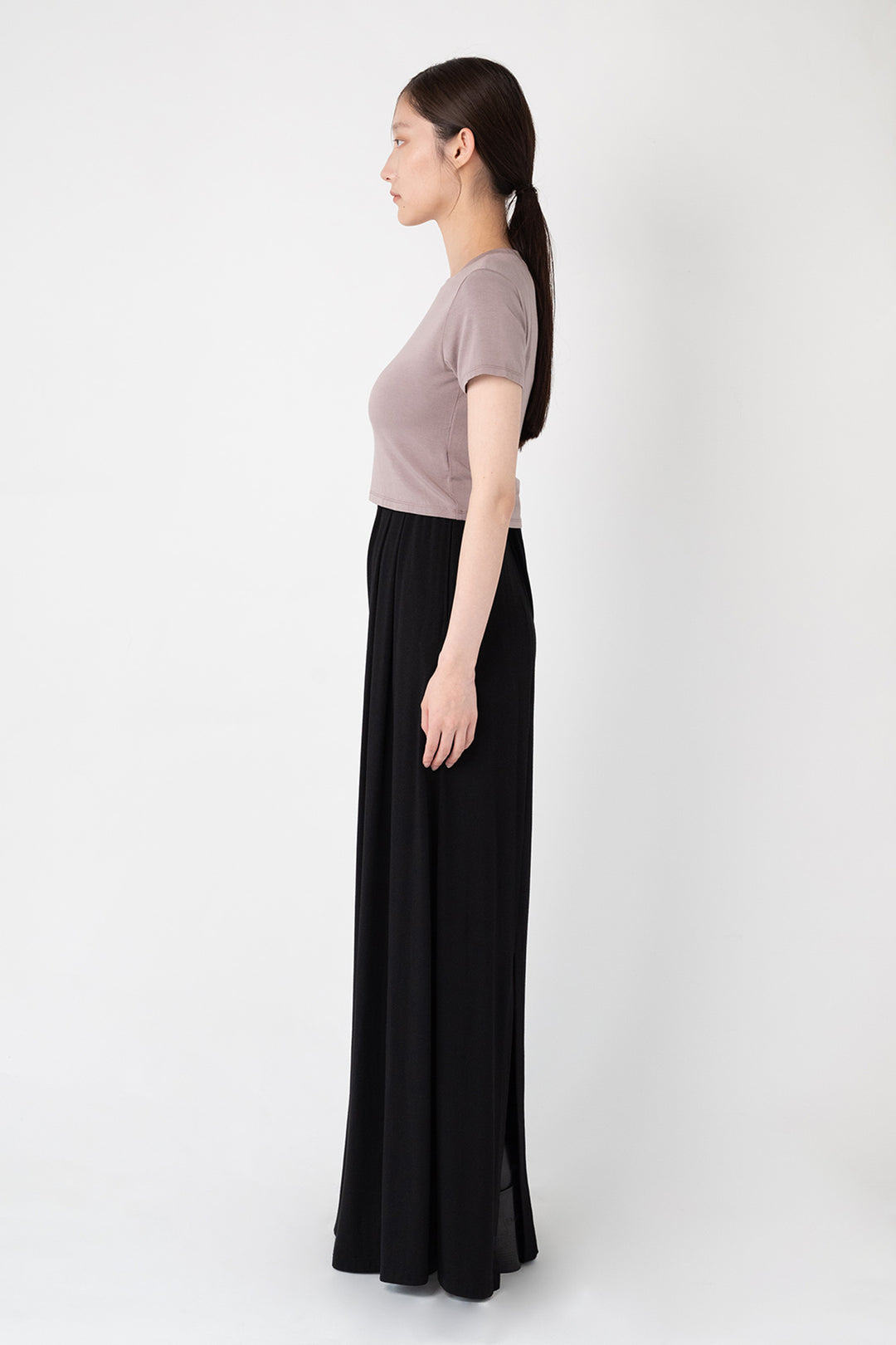 Woman modeling side of collagen fabric Back Slit Wide Pants