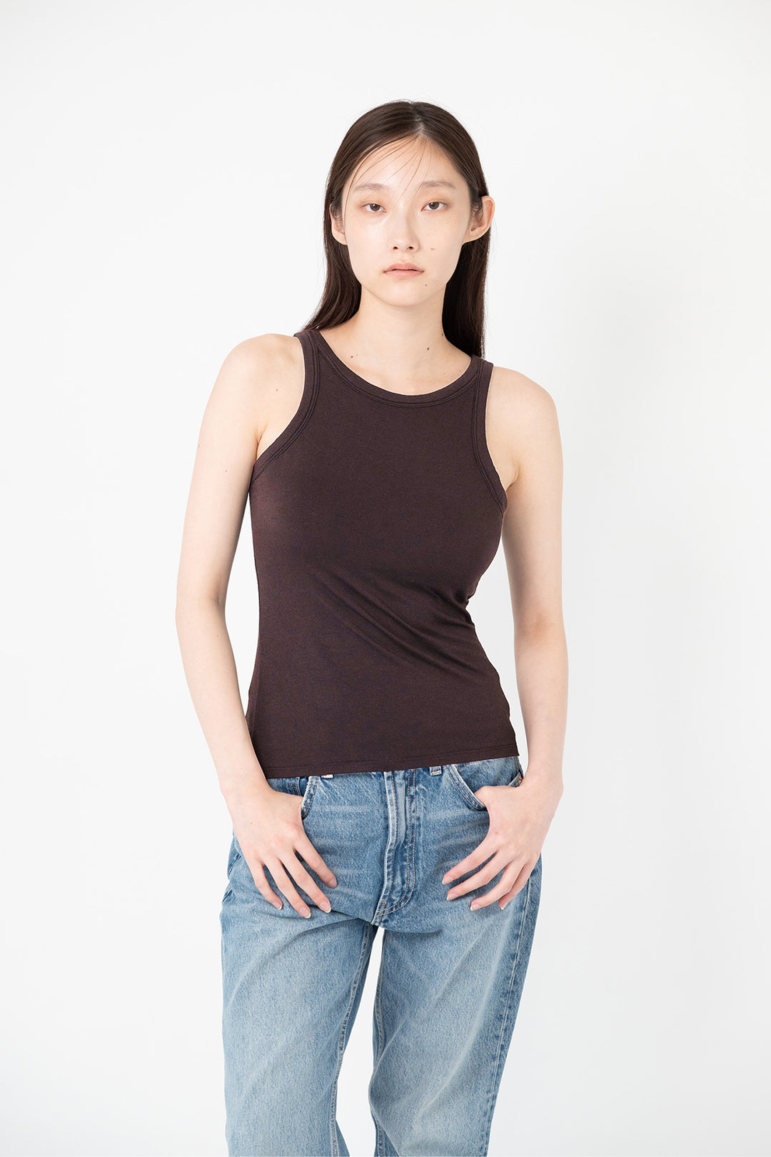 woman modeling brown determ collagen tank top